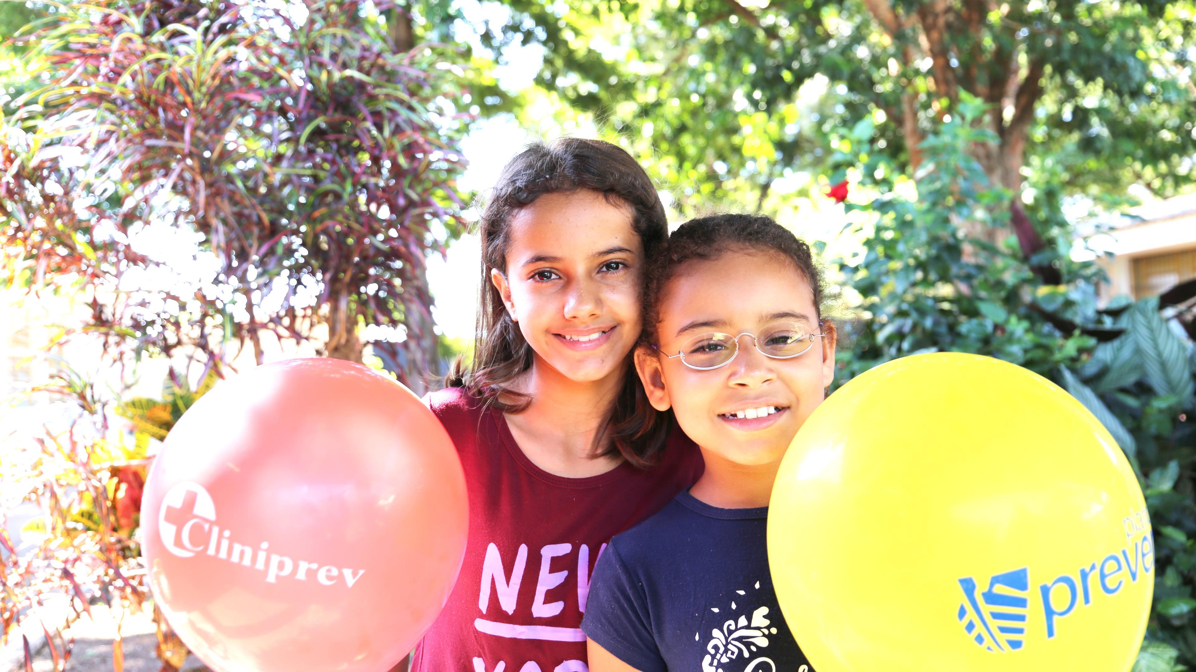 Two friends from Brazil, head to head, one wearing OneDollarGlasses